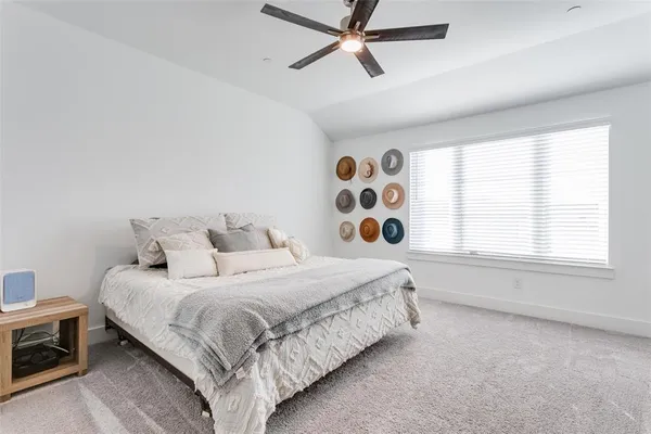 a room with a flat screen tv and a window