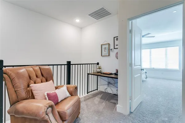 a balcony with furniture and a view of bedroom