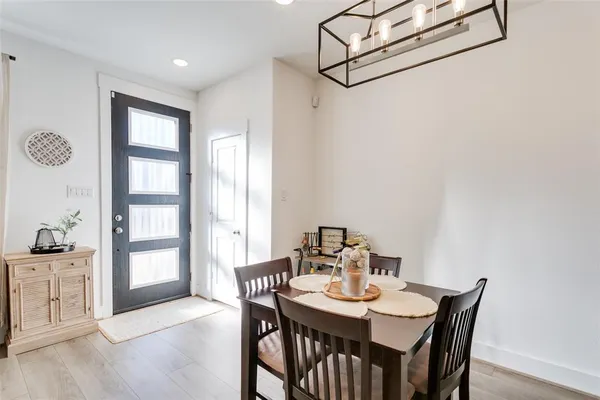 a view of a dining room with furniture and window