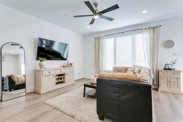 a kitchen with refrigerator and microwave