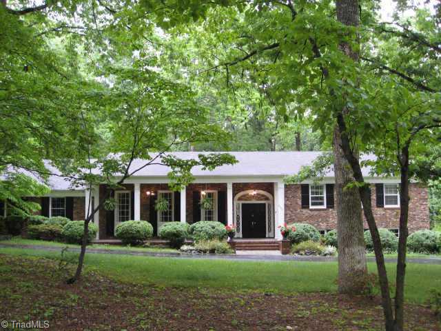 3320 North Rockingham Road Greensboro, NC 27407 - Photo 1 of 9 Exterior Front. Front elevation. Circle Drive. Priceless hardwood trees.