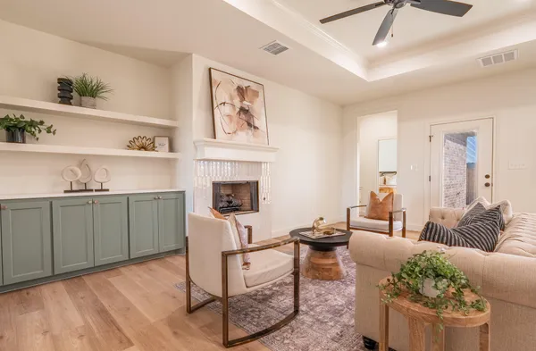 a living room with furniture and a fireplace