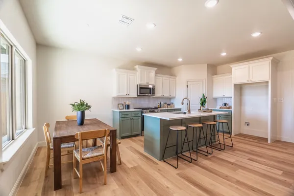 a kitchen with kitchen island granite countertop a sink and counter space