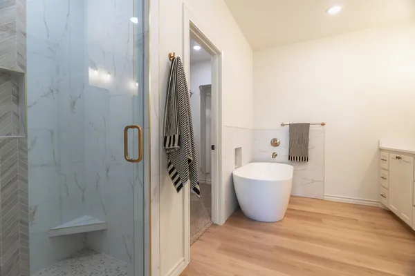 a bathroom with a bathtub and toilet