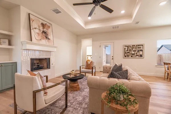 a living room with furniture and a fireplace