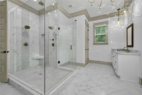 a view of a hallway with wooden floor and stairs