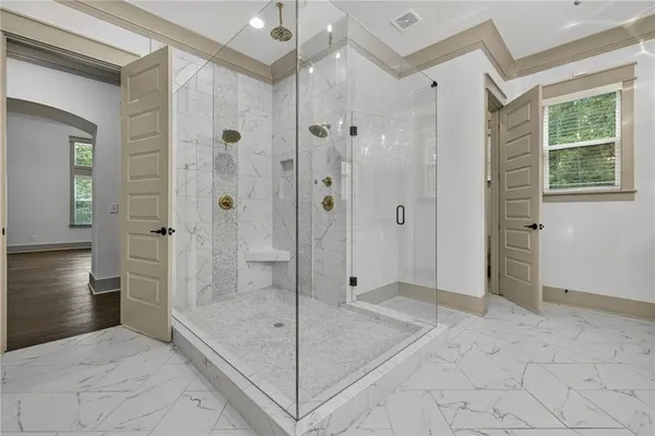 a bedroom with a bed closet and a window