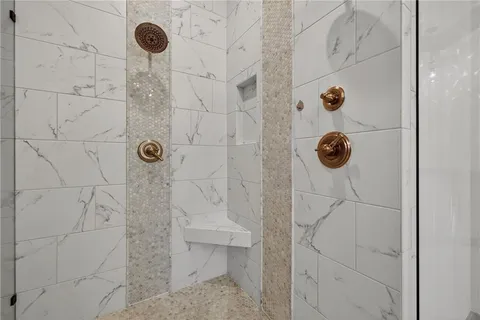 a bedroom with a bed closet and a window