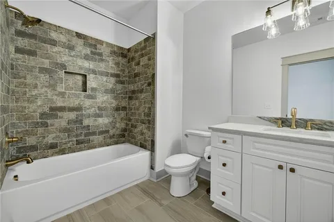 an aerial view of a house with a yard and outdoor seating