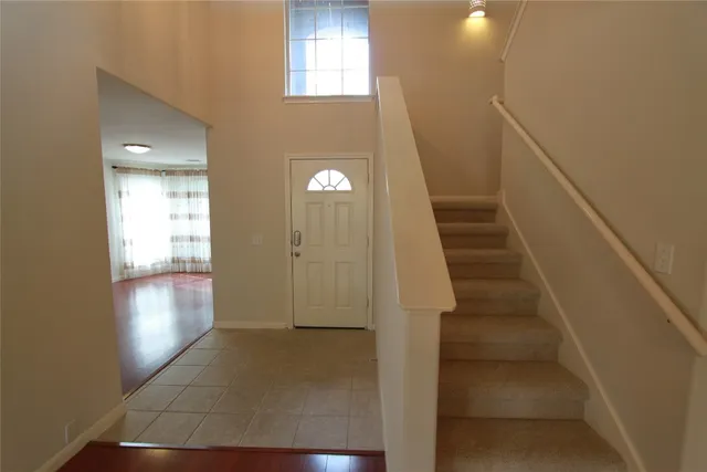 a view of entryway and hall with a window