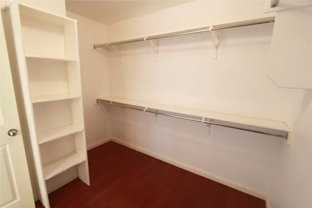 a view of an empty walk in closet