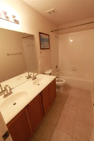 a view of an empty room and a window