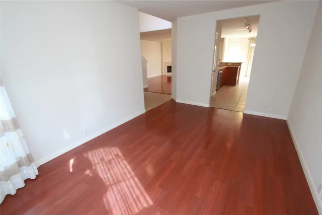 a view of hallway with wooden floor