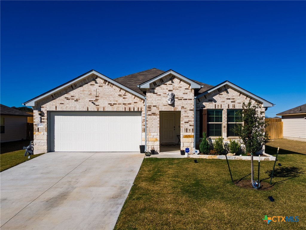 5105 Natalia Road Killeen, TX 76549 - Photo 1 of 15 a front view of a house with garden