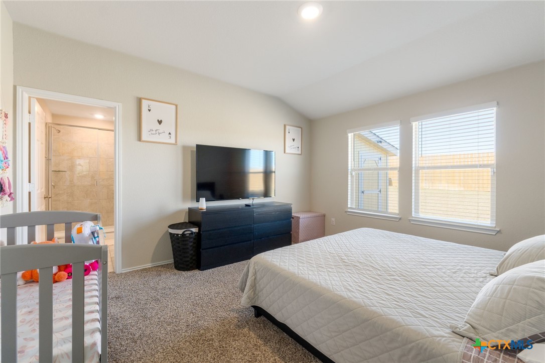 5105 Natalia Road Killeen, TX 76549 - Photo 11 of 15 a bedroom with a bed and a flat screen tv