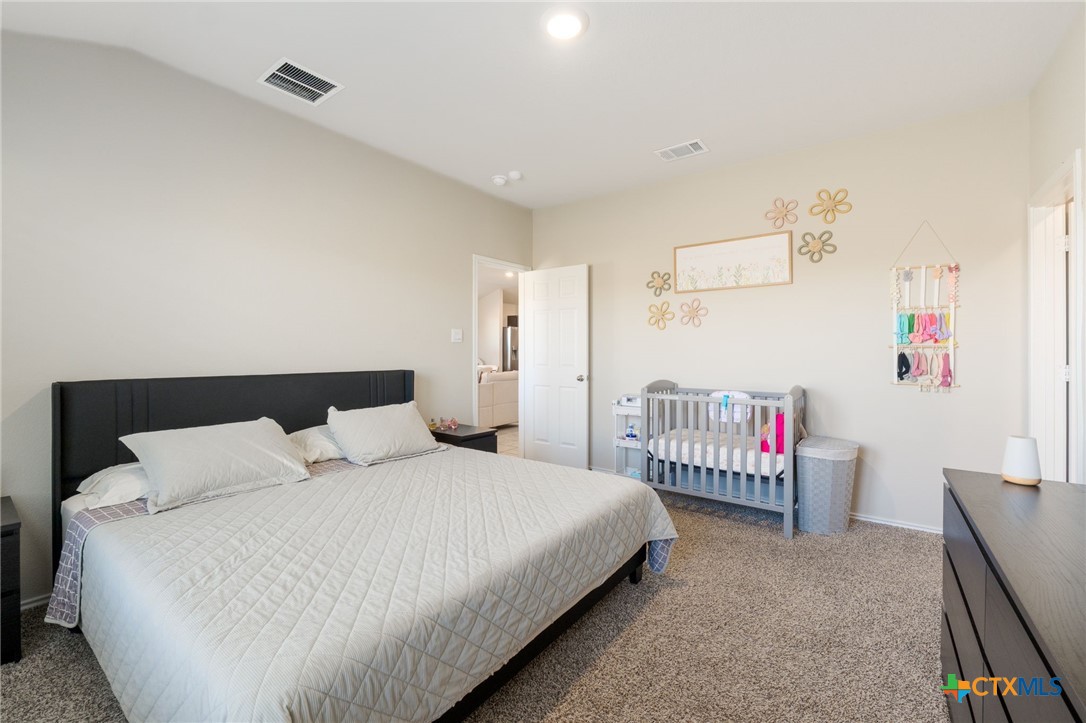 5105 Natalia Road Killeen, TX 76549 - Photo 12 of 15 a bedroom with a bed and a window