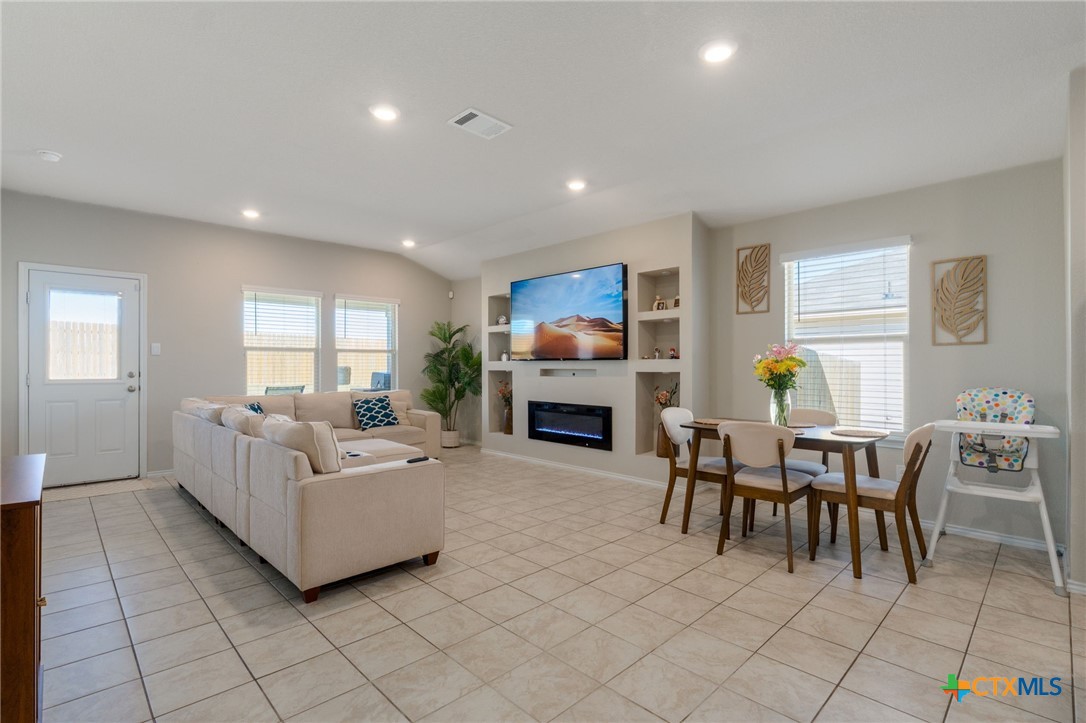5105 Natalia Road Killeen, TX 76549 - Photo 2 of 15 a living room with fireplace furniture and a wooden floor