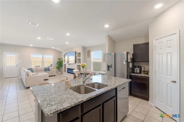 a large kitchen with granite countertop lots of counter top space
