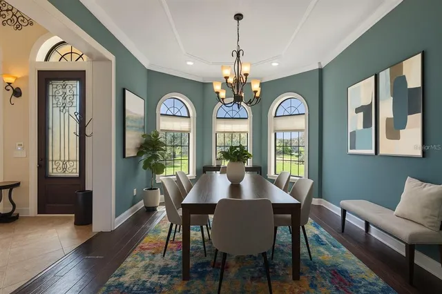 a bathroom with a tub a sink and a window