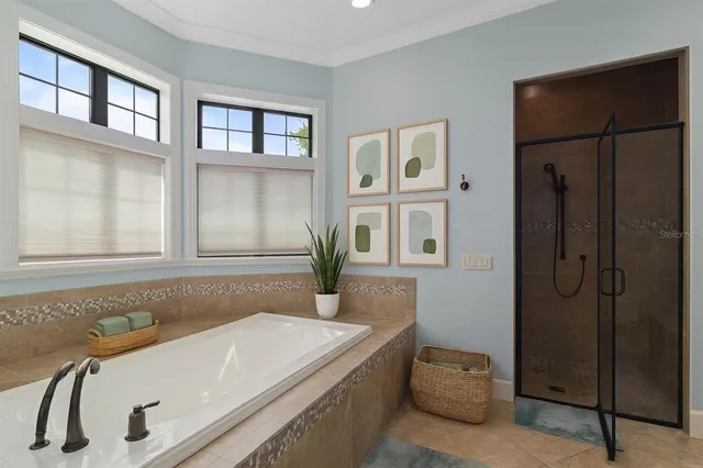 a bathroom with double vanity sinks a mirror and a shower