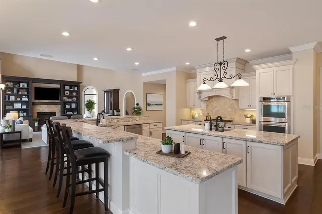 a bedroom with a bed couch and a large window