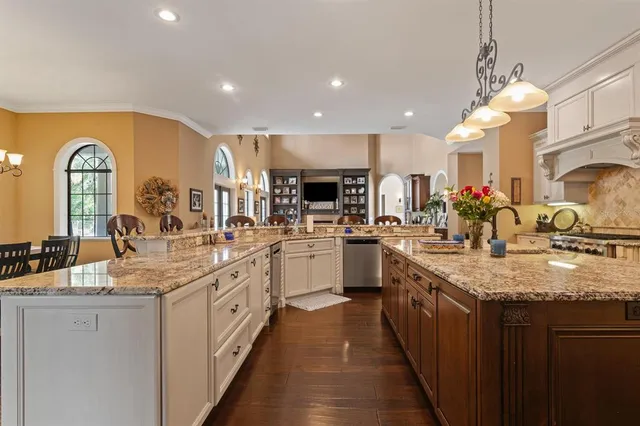 a bathroom with a sink vanity granite and toilet
