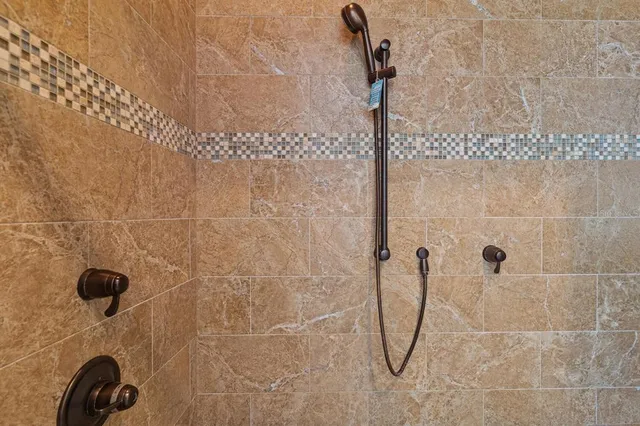 a kitchen with stainless steel appliances granite countertop a sink refrigerator and cabinets