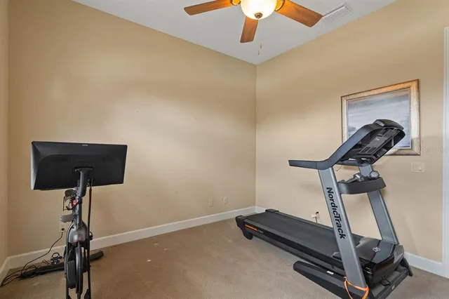 a bedroom with a bed and a large window with the outer view