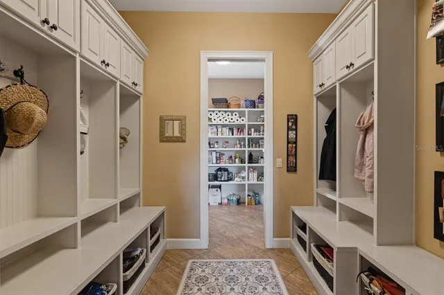 a bathroom with a sink vanity mirror and shower