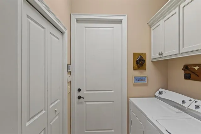 an aerial view of a house with a swimming pool yard and outdoor seating