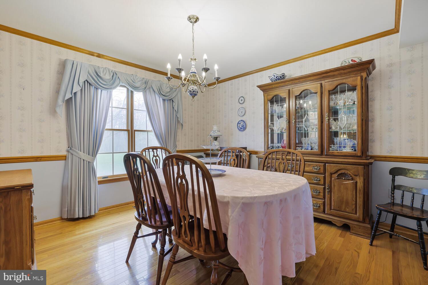 1050 Huntfield Road Westminster, MD 21157 - Photo 12 of 38 a view of a dining room with furniture window and wooden floor