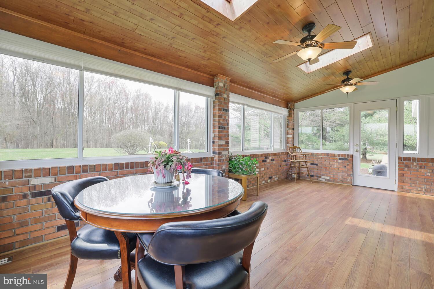 1050 Huntfield Road Westminster, MD 21157 - Photo 13 of 38 a dining room with furniture and a floor to ceiling window