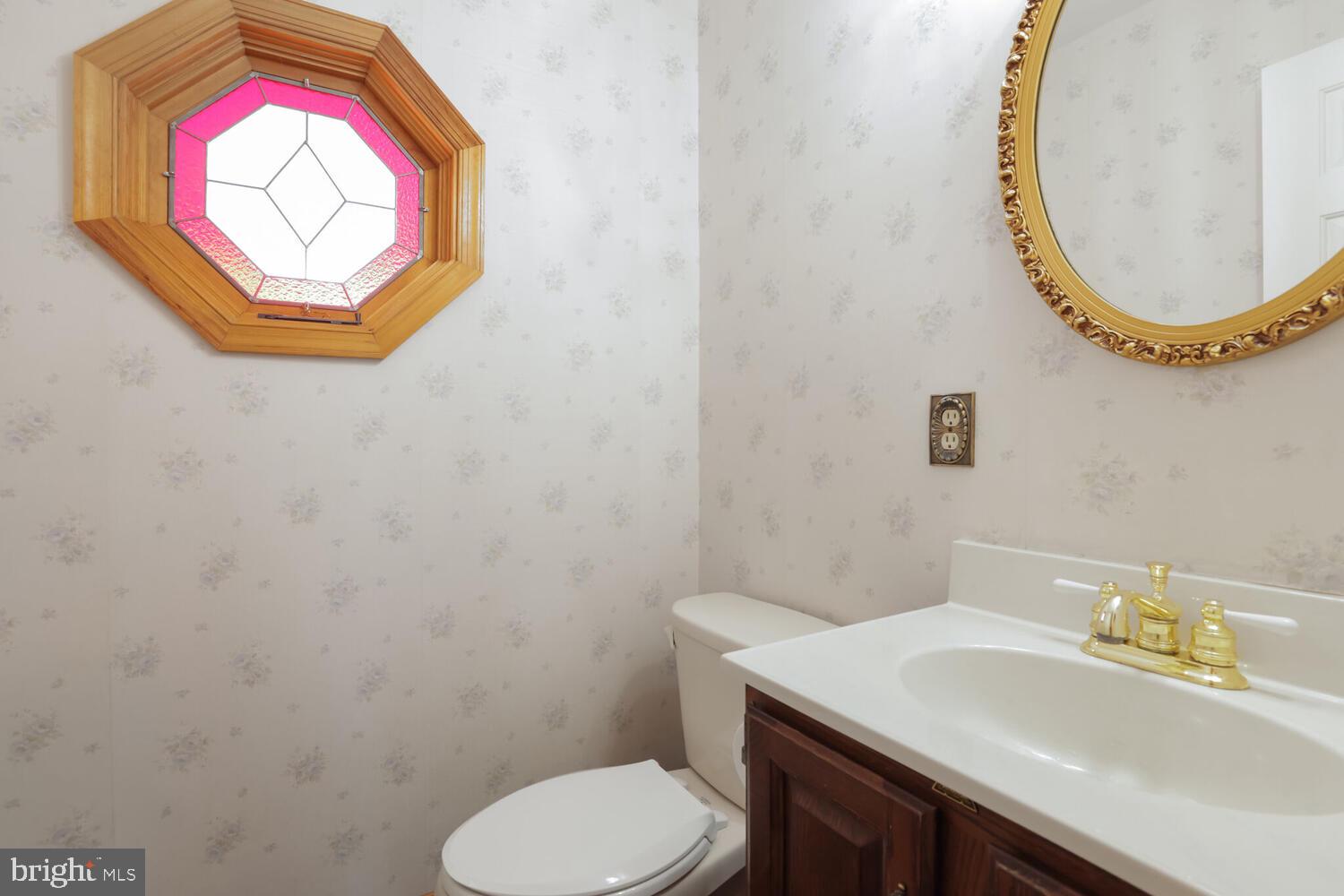 1050 Huntfield Road Westminster, MD 21157 - Photo 14 of 38 a bathroom with a sink and a mirror