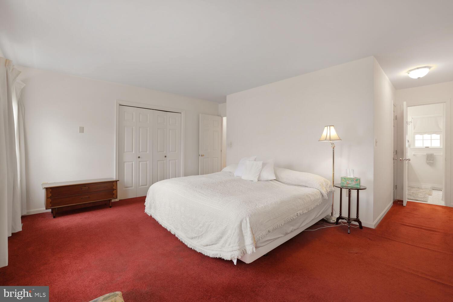 1050 Huntfield Road Westminster, MD 21157 - Photo 19 of 38 a bedroom with a bed and a lamp