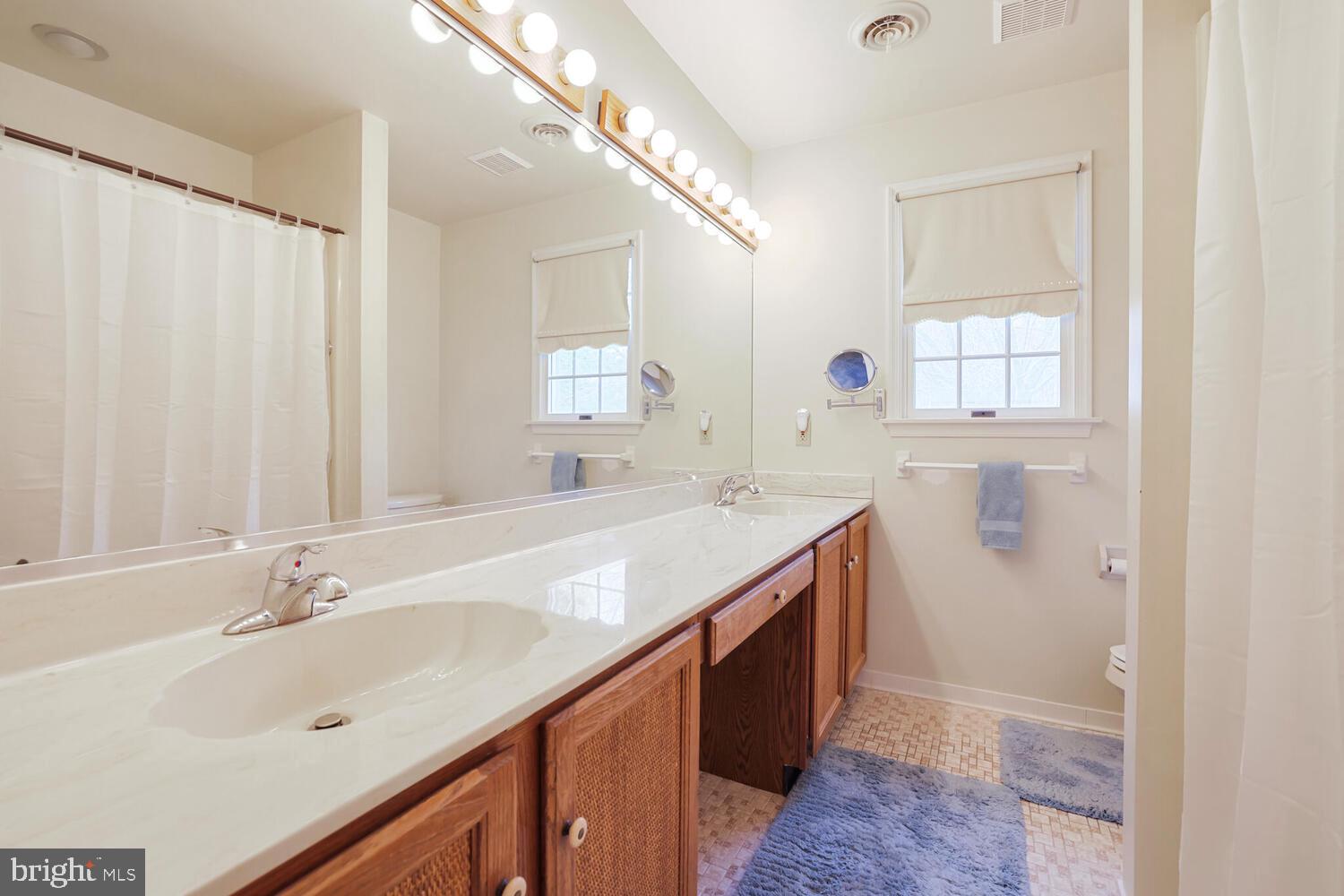 1050 Huntfield Road Westminster, MD 21157 - Photo 21 of 38 a spacious bathroom with a double vanity sink mirror and
