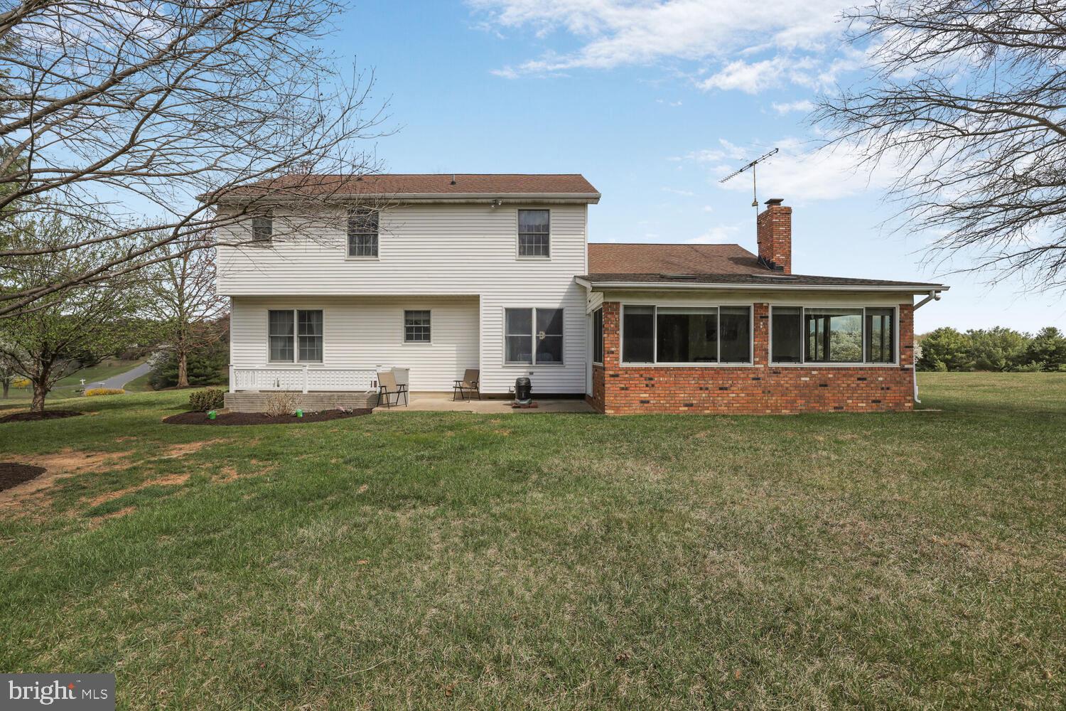 1050 Huntfield Road Westminster, MD 21157 - Photo 27 of 38 a front view of a house with a yard