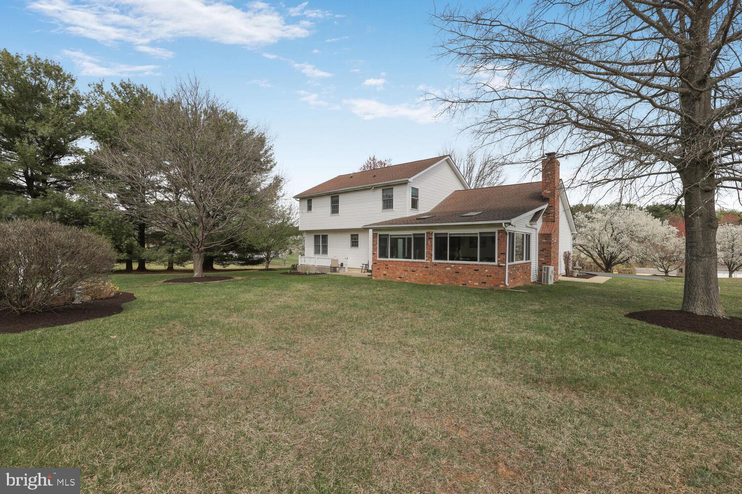 1050 Huntfield Road Westminster, MD 21157 - Photo 28 of 38 a front view of a house with a garden