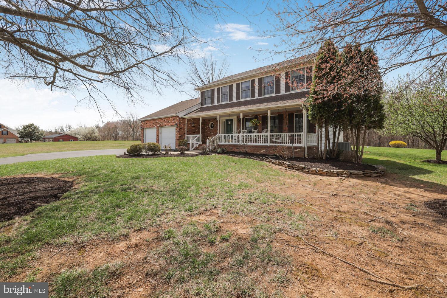 1050 Huntfield Road Westminster, MD 21157 - Photo 30 of 38 a view of a house with a yard and sitting area