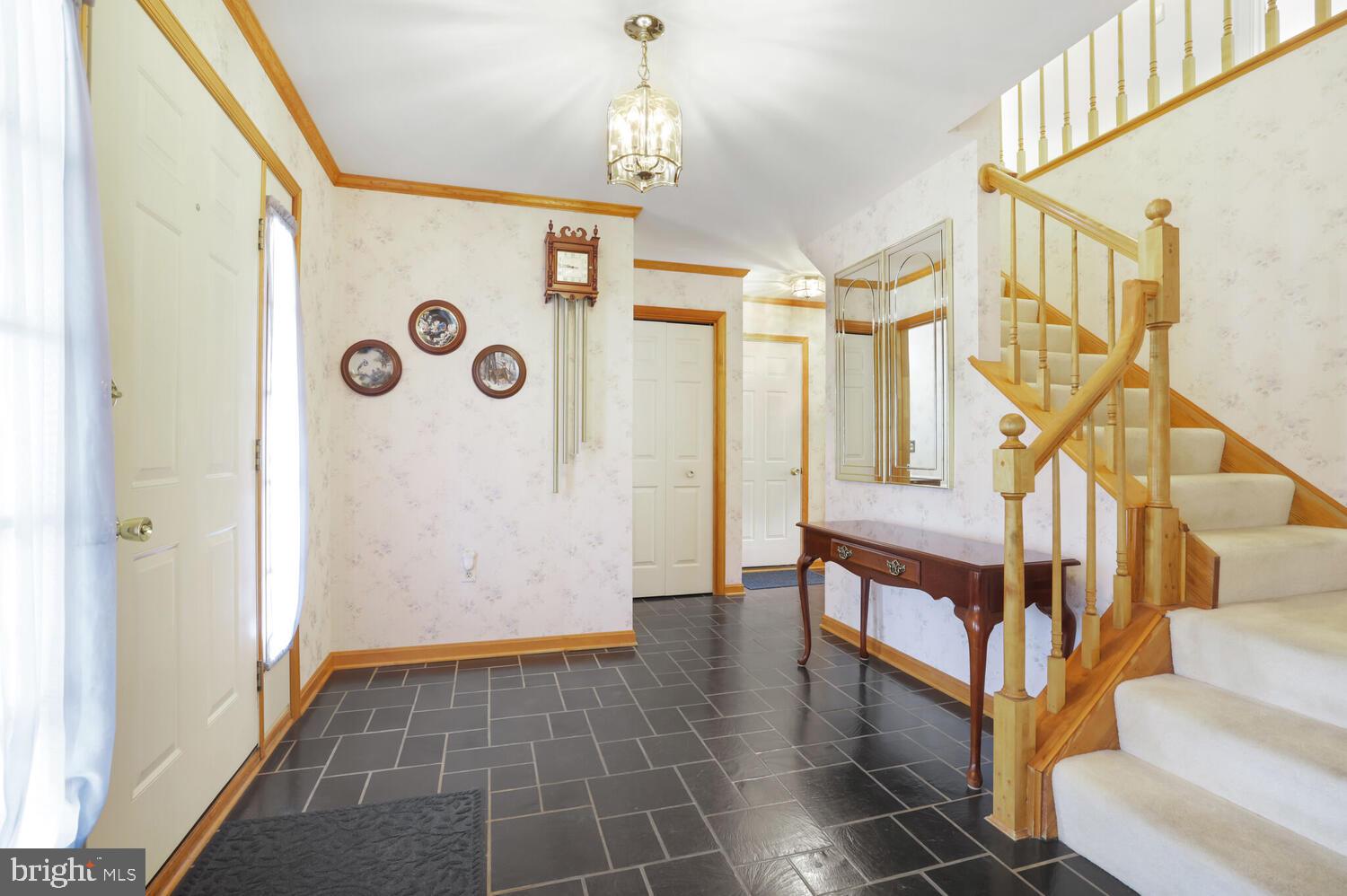1050 Huntfield Road Westminster, MD 21157 - Photo 4 of 38 a view of entryway with stairs and wooden floor