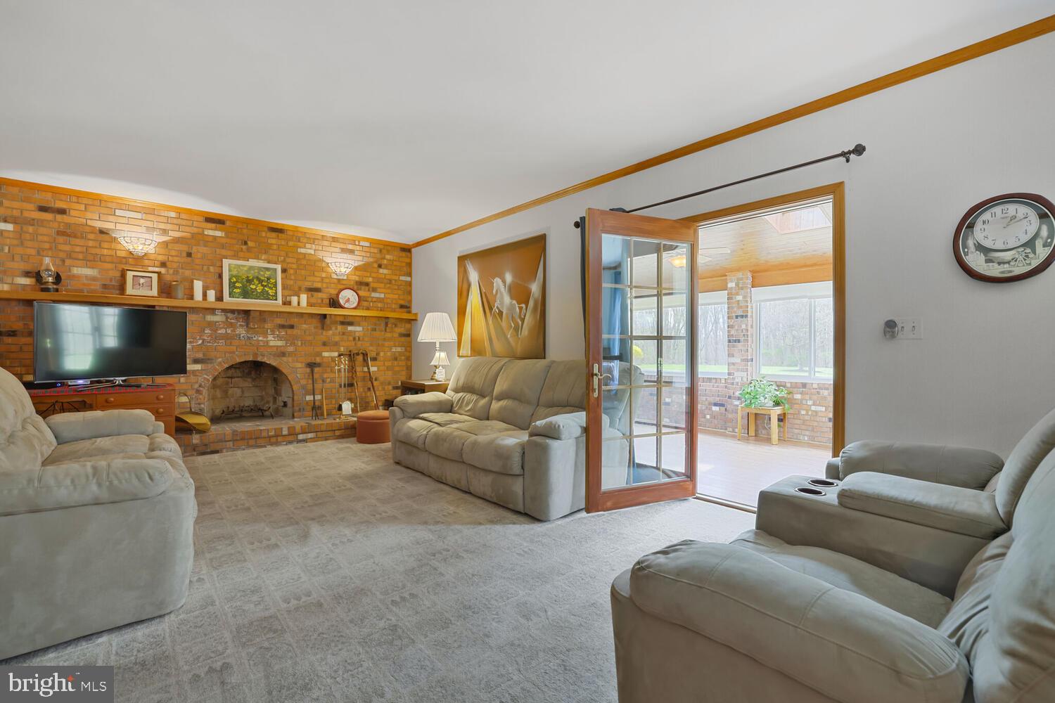 1050 Huntfield Road Westminster, MD 21157 - Photo 10 of 38 a living room with furniture a large window and a fireplace