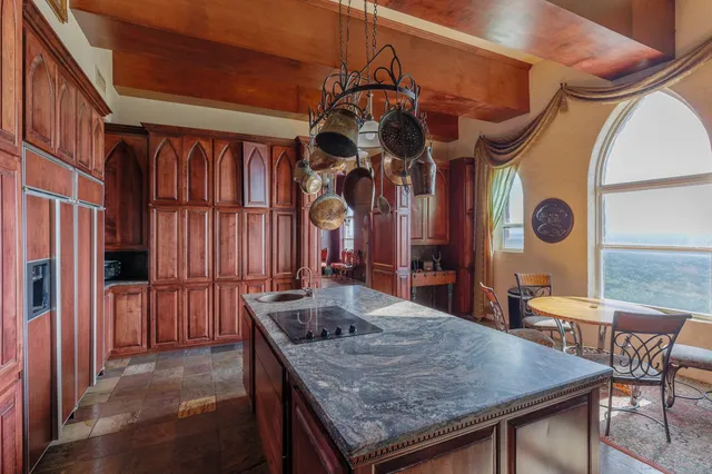 a kitchen with a table and chairs
