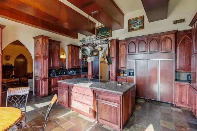 a bedroom with a bed and balcony view