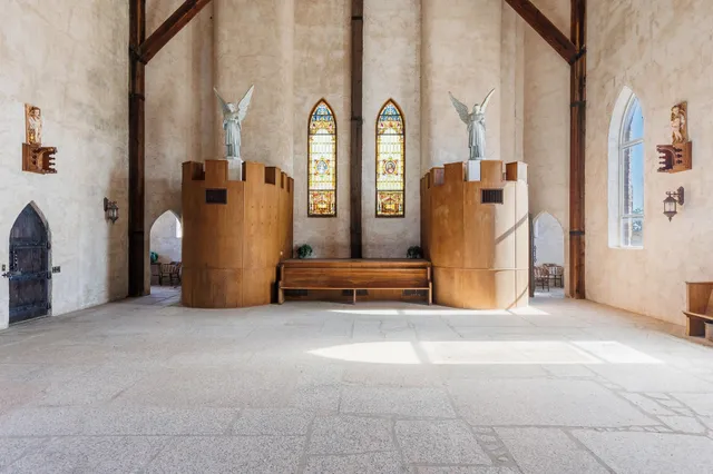 a view of lobby with furniture and a fireplace