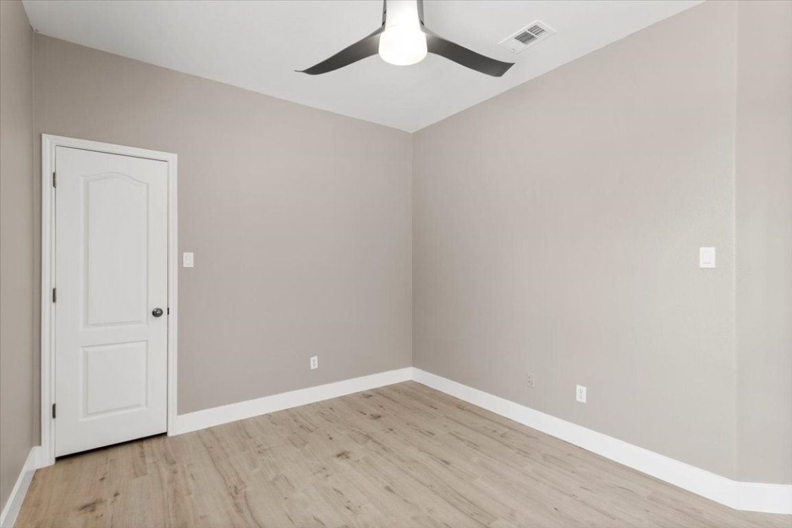 3702 Tall Cedars Road Cedar Park, TX 78613 - Photo 18 of 34 a view of an empty room with wooden floor