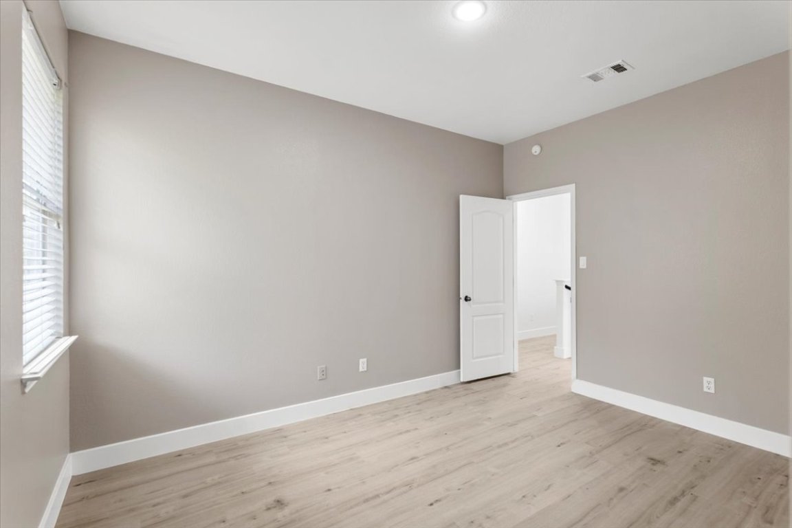 3702 Tall Cedars Road Cedar Park, TX 78613 - Photo 21 of 34 a view of an empty room with wooden floor