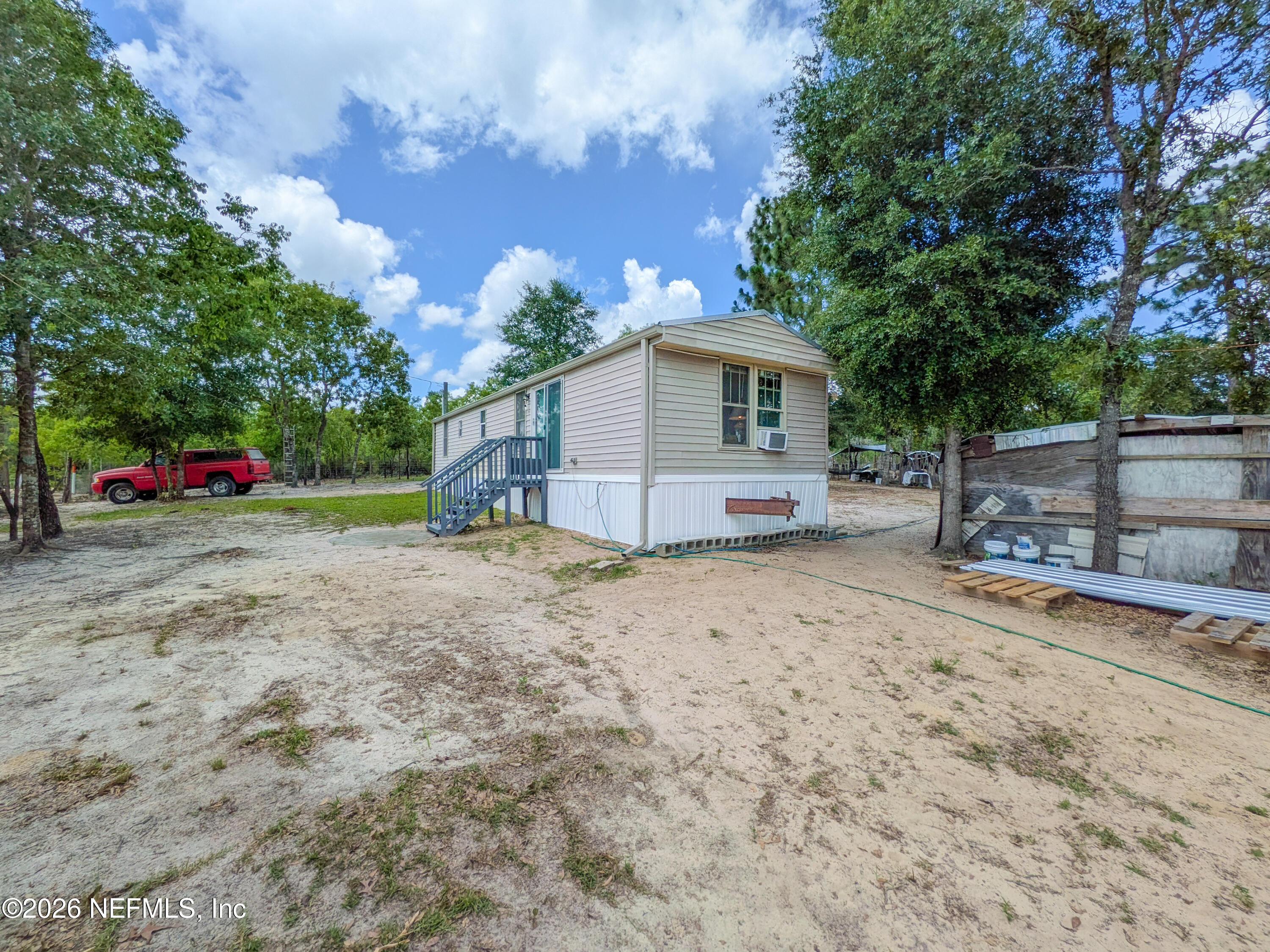 116 London Avenue Interlachen, FL 32148 - Photo 21 of 25 a view of a house with a backyard