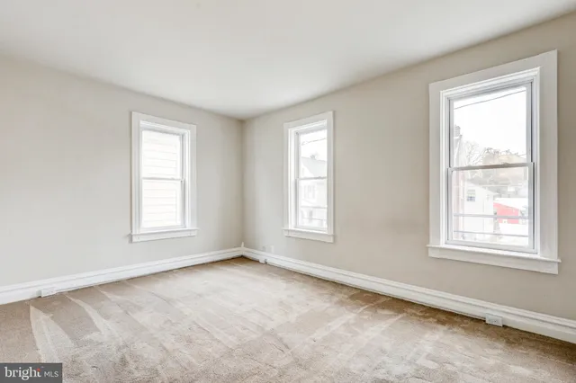 an empty room with windows