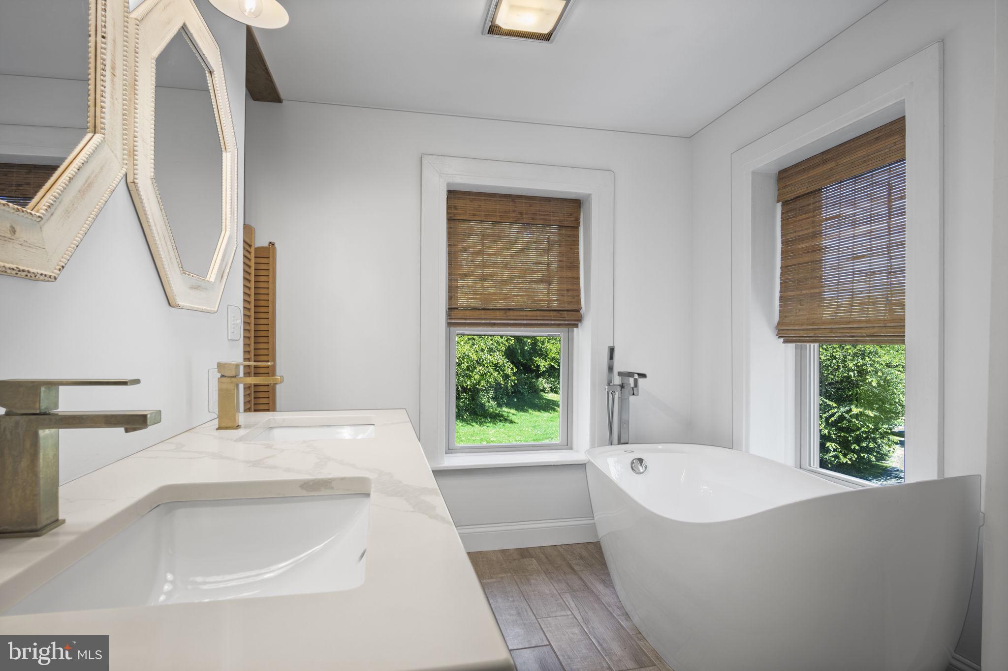 154 Calvary Church Road Wrightsville, PA 17368 - Photo 67 of 89 a bathroom with a granite countertop bathtub a window and a shower