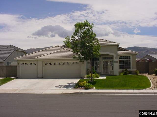 1130 Broadview Court Reno, NV 89521 - Photo 1 of 6 a front view of a house with a garden