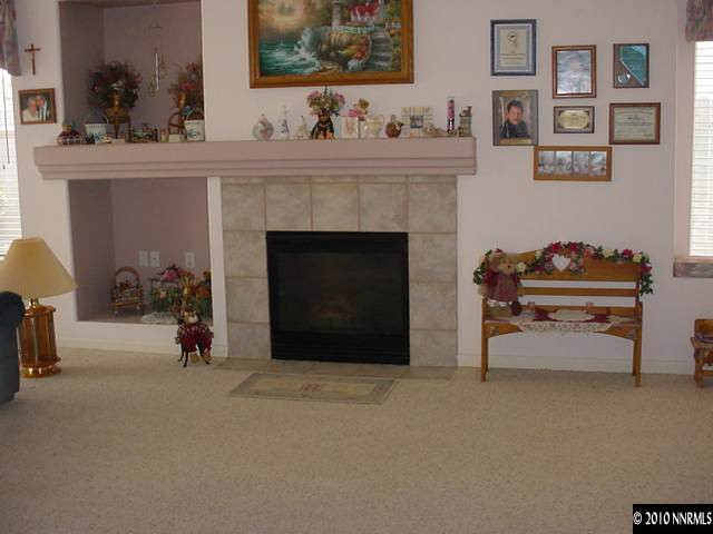 1130 Broadview Court Reno, NV 89521 - Photo 4 of 6 a living room with furniture and a fireplace